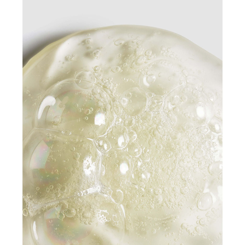 Close-up of a textured surface with bubbles and a white background