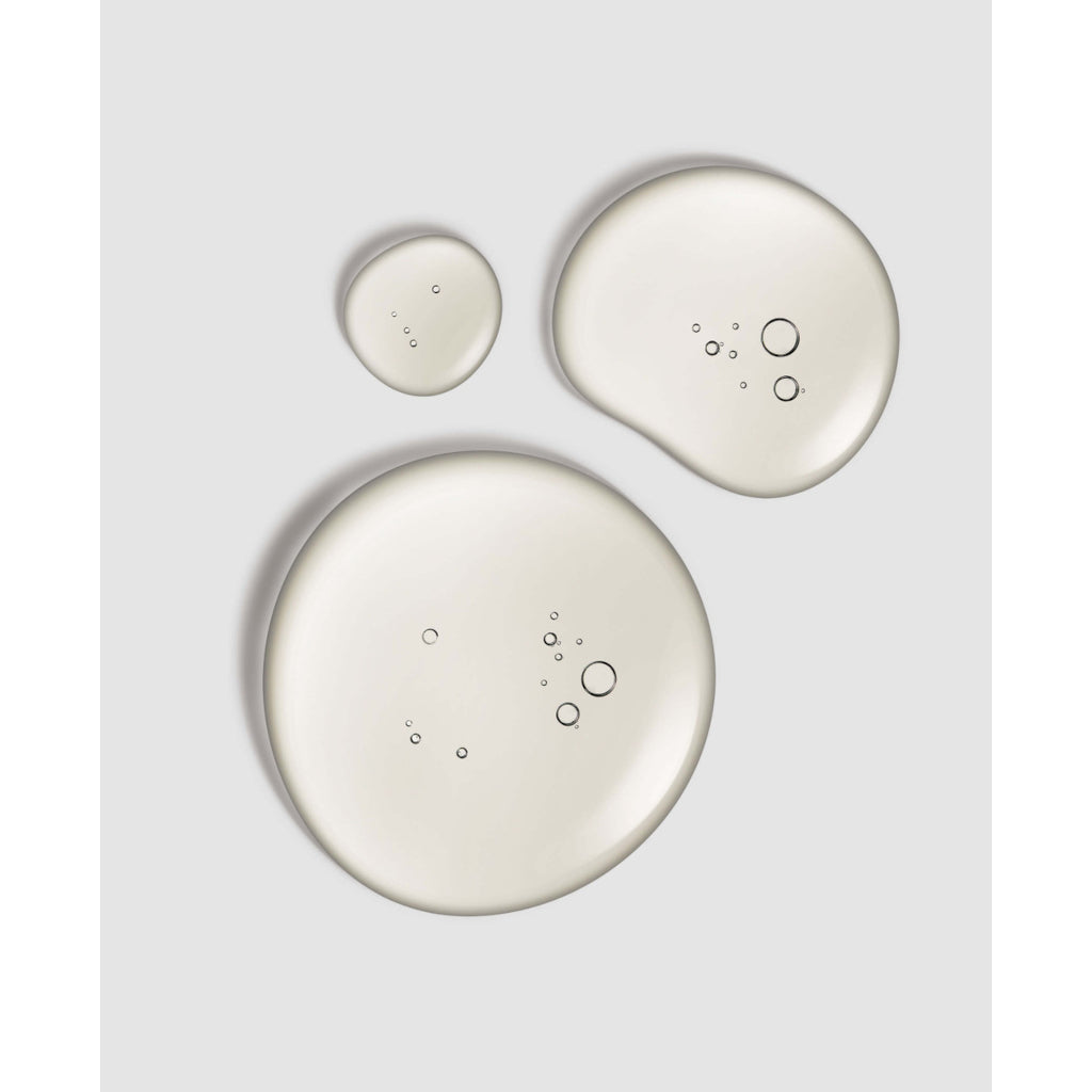 Three ceramic plates of different sizes on a light gray background