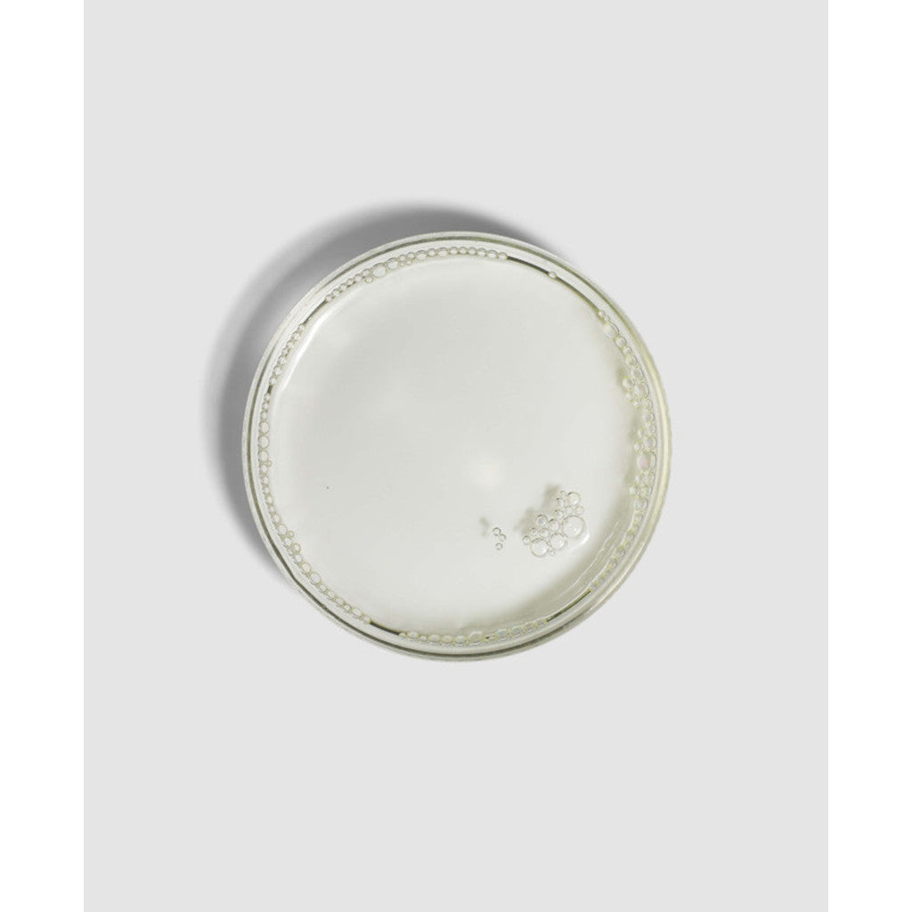 Round ceramic plate with decorative edge on a light gray background