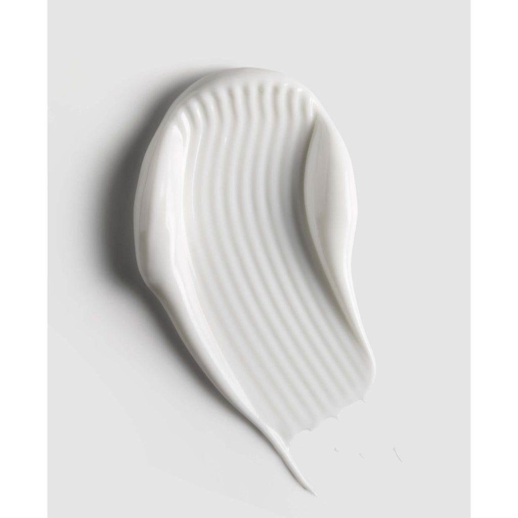 White ceramic spoon rest on a light gray background