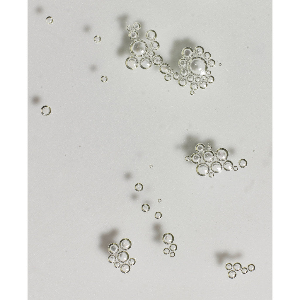 Small metallic objects on a light gray background