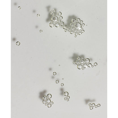 Small metallic objects on a light gray background