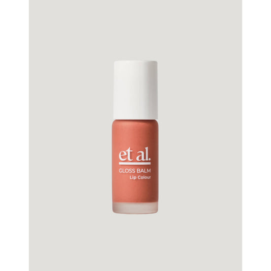 Lip balm with 'etal' branding on a light gray background