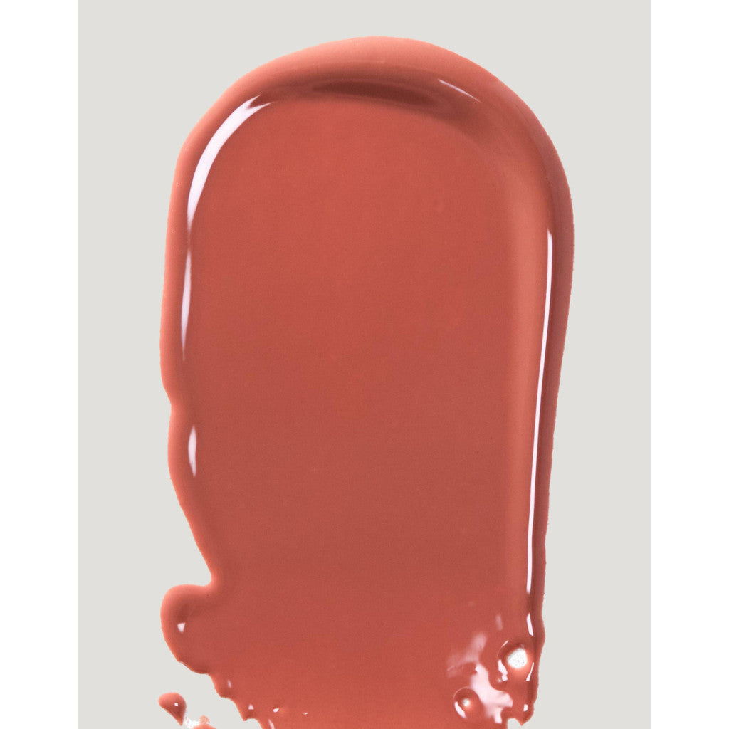 Dripping red-orange paint on a gray background