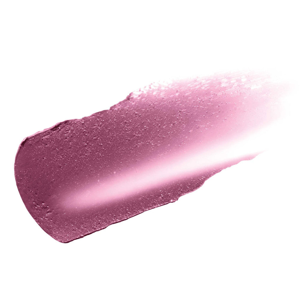 Close-up of a pink lip gloss swatch on a white background