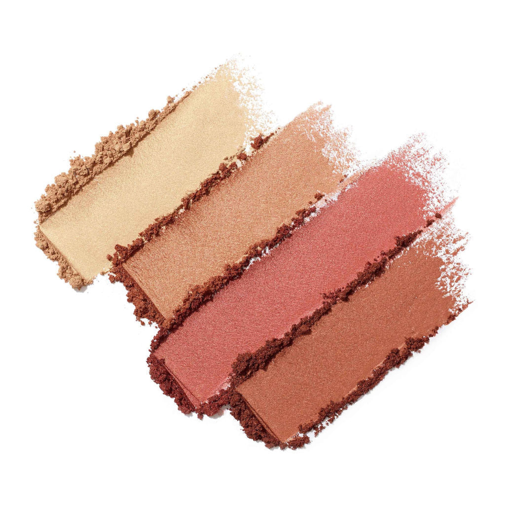 Set of five swatches of different shades of makeup powder on a white background