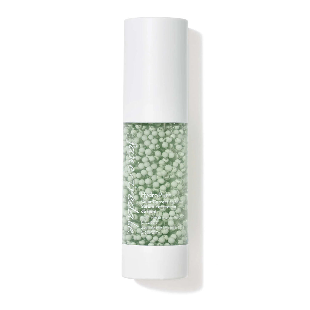 Skincare bottle with green gel and white cap on a white background