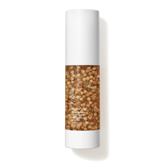 Skincare product with visible beads in a cylindrical container on a white background