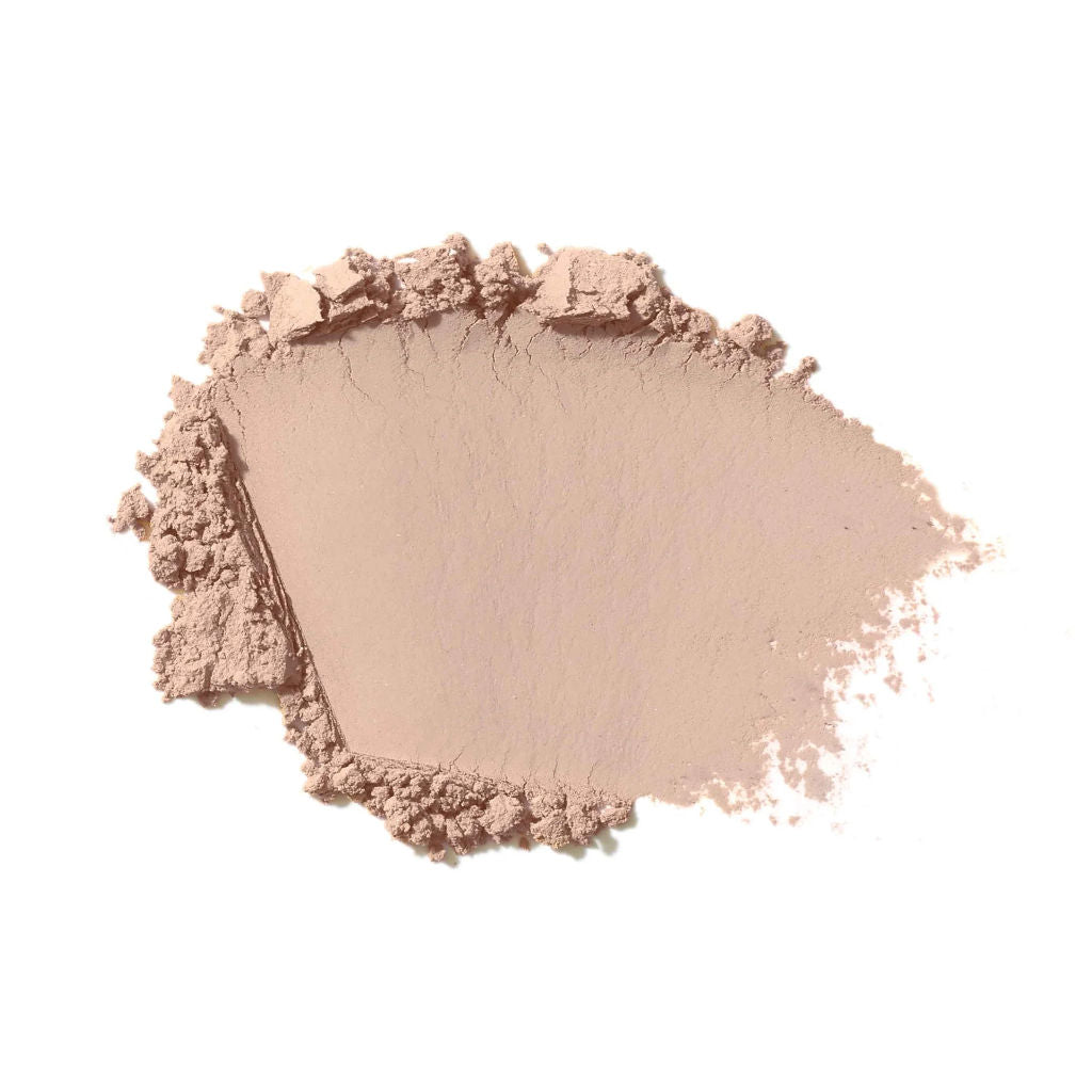 Suntan shade makeup powder on a white background