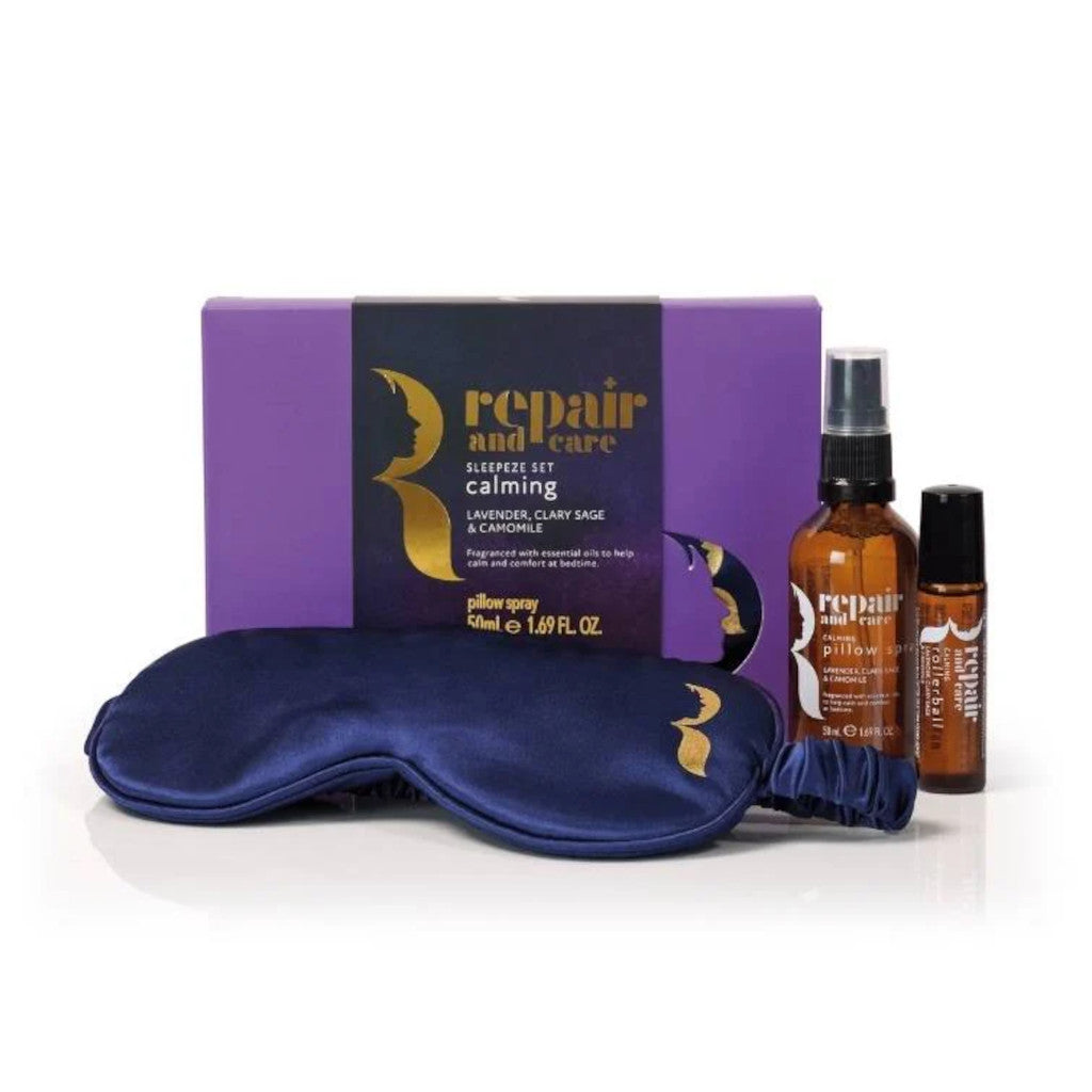 Sleep set with eye mask, pillow spray, and essential oils on a white background